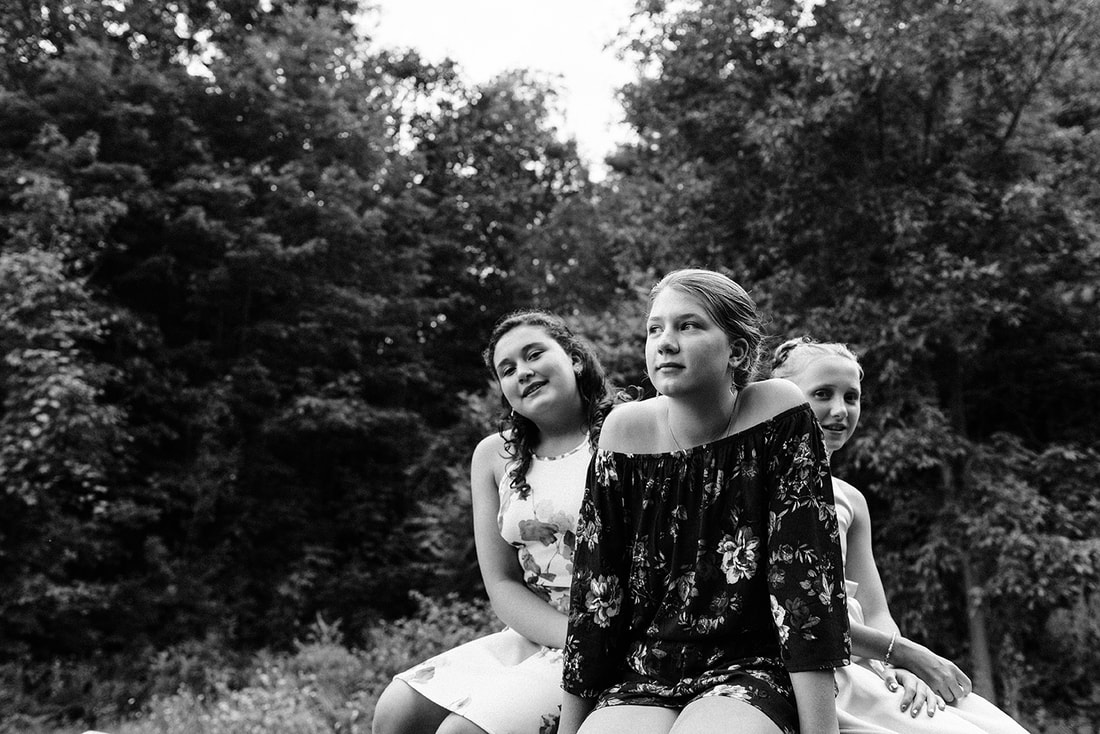 three young women at a wedding in Rockport Ontario