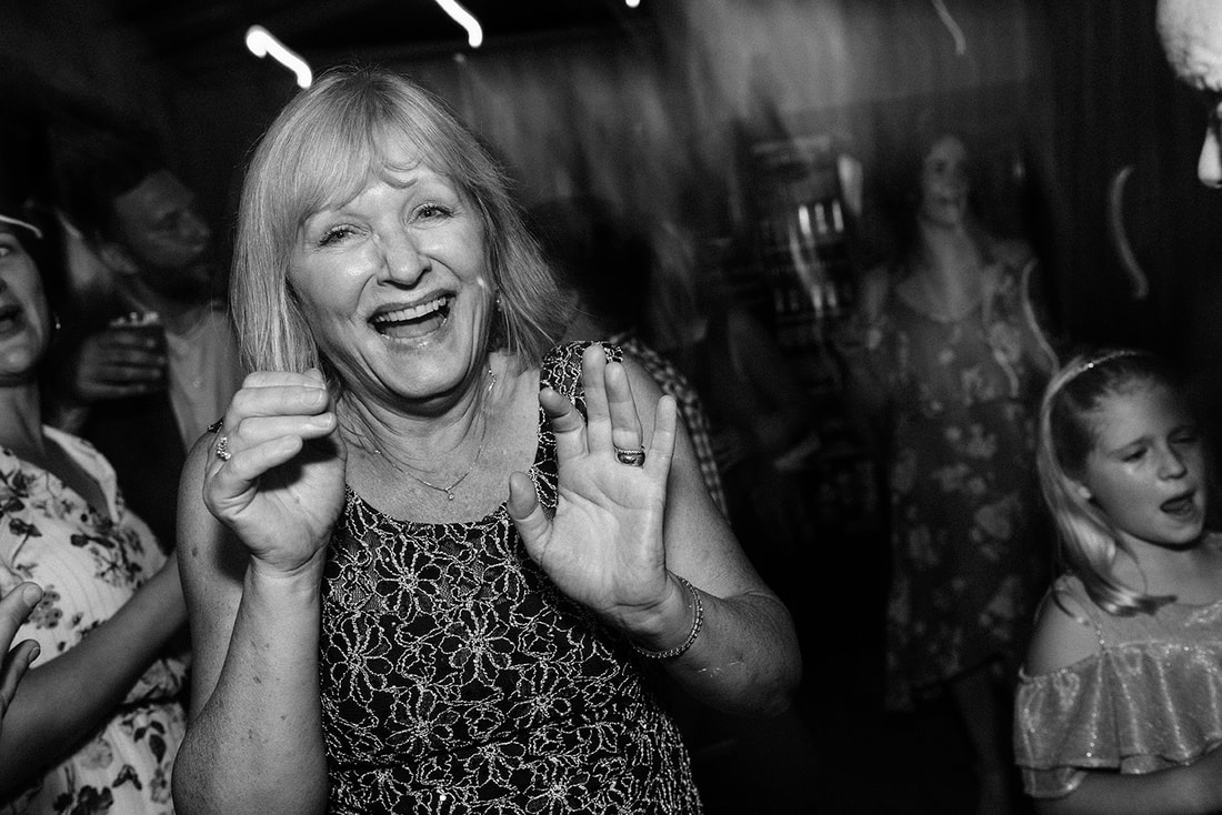 Mother of the groom dancing at Rockport Barn