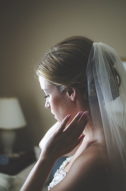 Bride adjusting veil