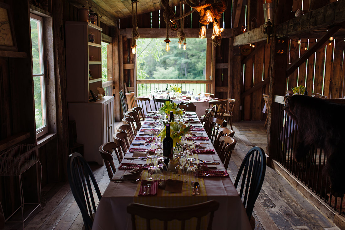 barn venue decorated for a wedding dinner