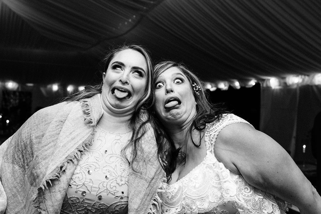 two sisters making funny faces at a prince edward county wedding