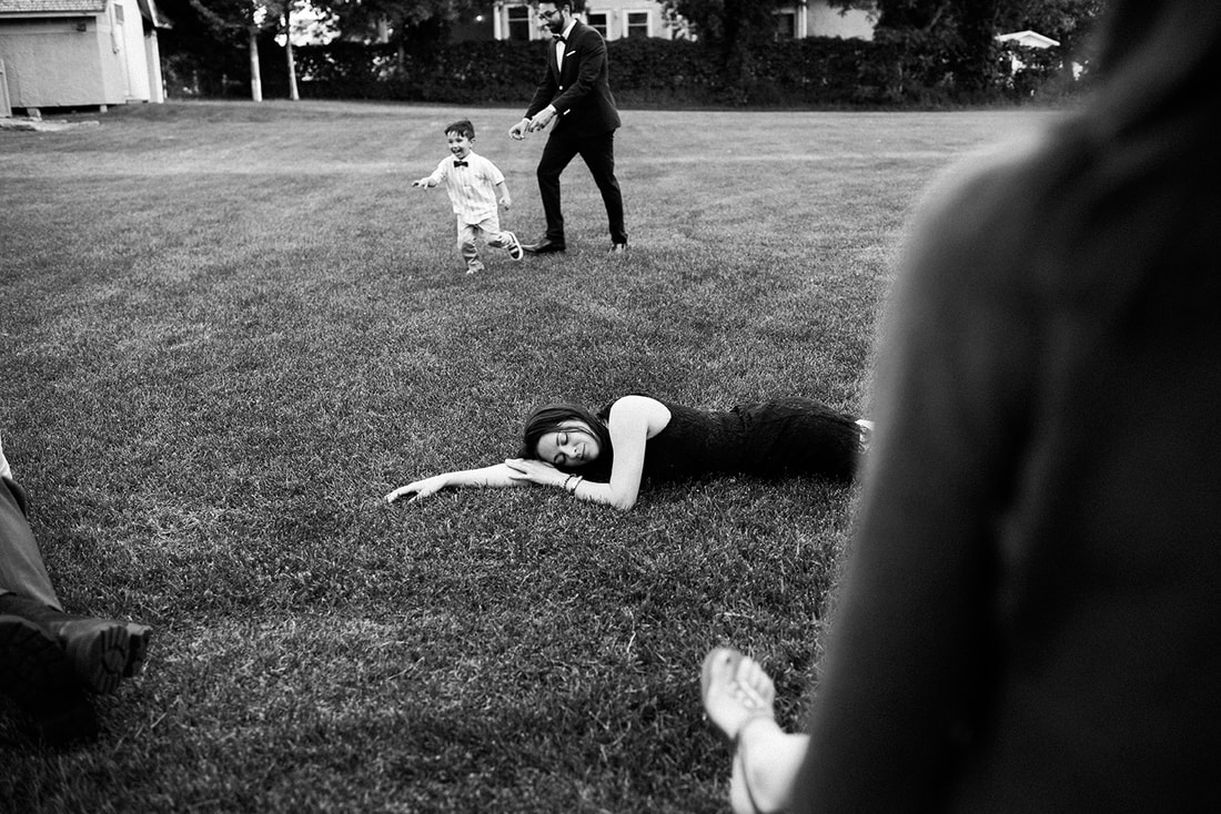 Woman sleeping on the grass after a wedding in Picton